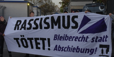 Aktivist*innen der IL Rhein-Neckar protestieren gegen Besuch von Olaf Scholz